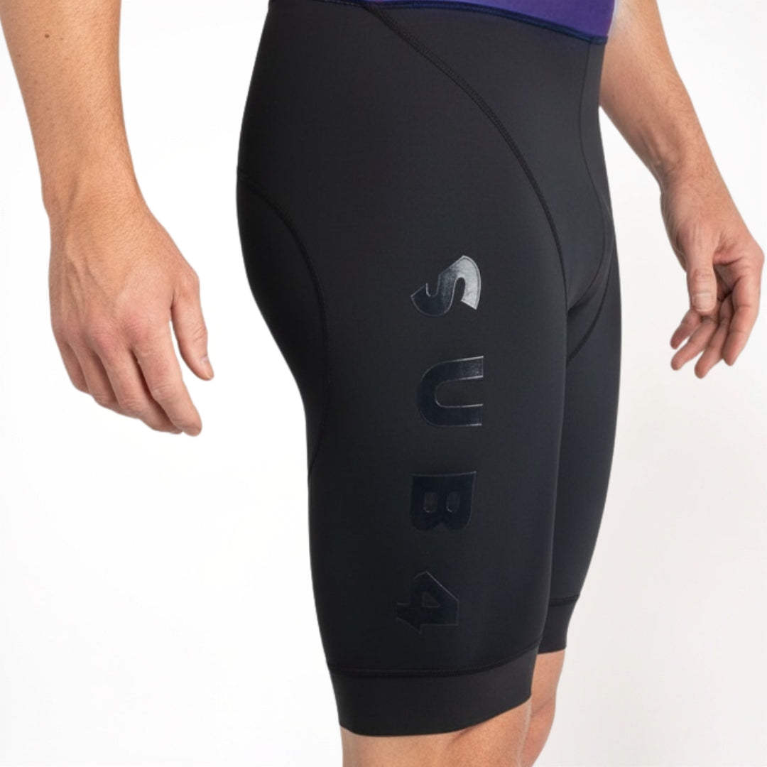 Black Tri Suit shorts with a brand logo on a white background