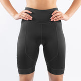 Black athletic triathlon shorts worn by a woman on a white background