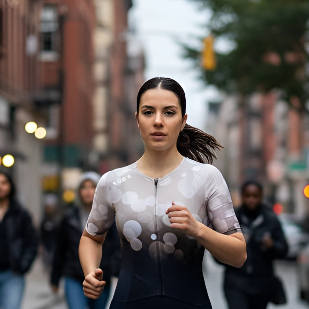 Woman running on a city street with blurred background