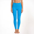 Blue athletic yoga leggings worn by a person on a white background