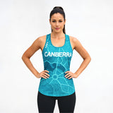 Woman wearing a blue tank top singlet with 'Canberra' printed on it against a white background