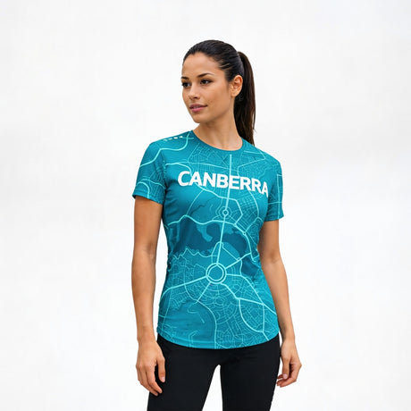 Woman wearing a blue t-shirt with 'Canberra' printed on it against a white background
